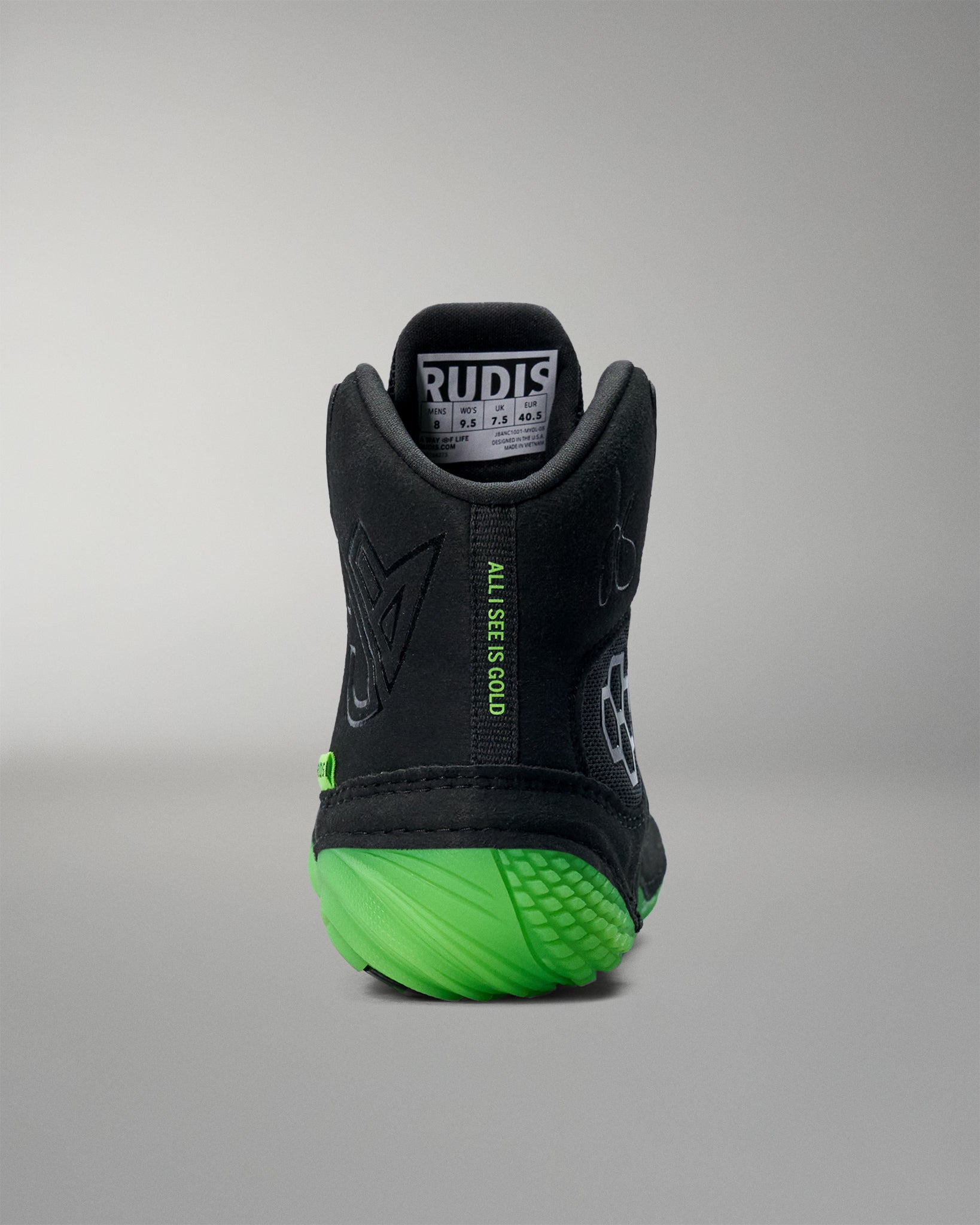 Black Wrestling shoe with green sole on a gray background