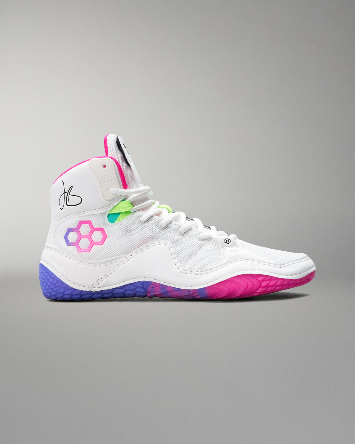 White wrestling shoe with colorful accents on a gray background