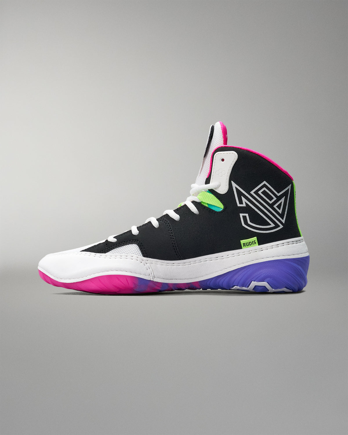 Multicolored wrestling shoe with black, white, pink, and green design on a gray background