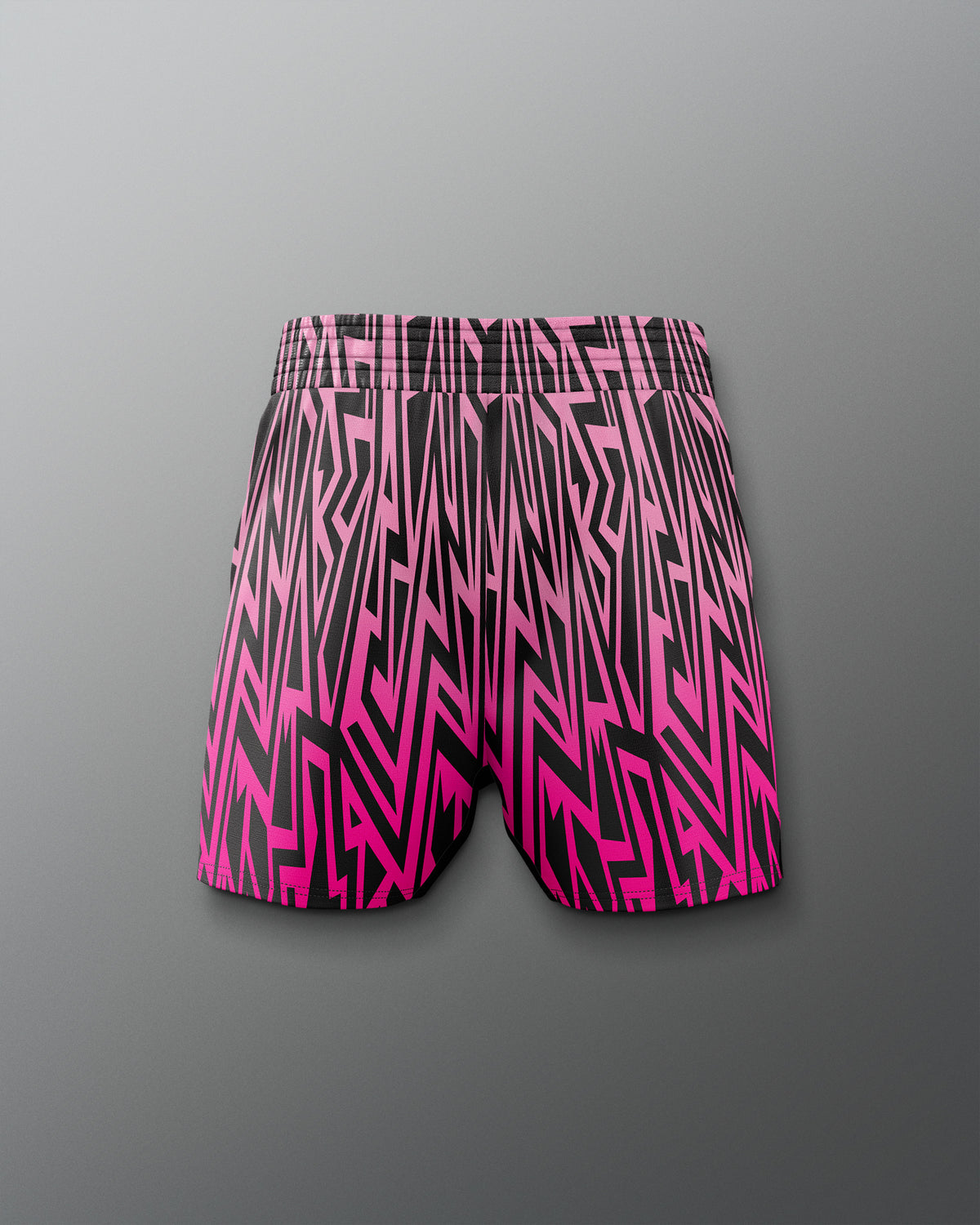 Pink and black patterned shorts on a gray background