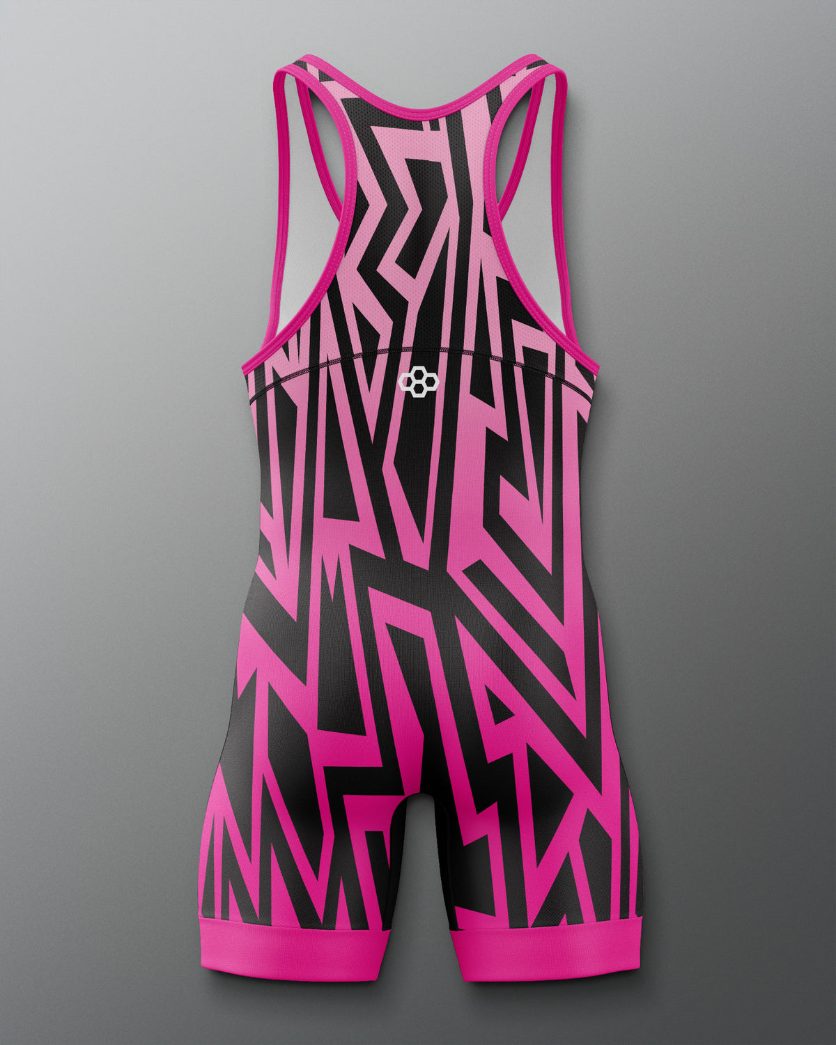 Pink and black patterned swimsuit on a gray background