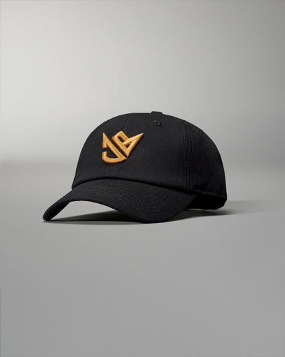 Black cap with gold logo on a gray background