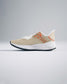 A stylish beige running shoe featuring a breathable mesh upper and a speckled sole designed for both comfort and performance