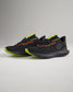 This image displays a stylish pair of black athletic shoes with bright green and red accents designed for performance and comfort