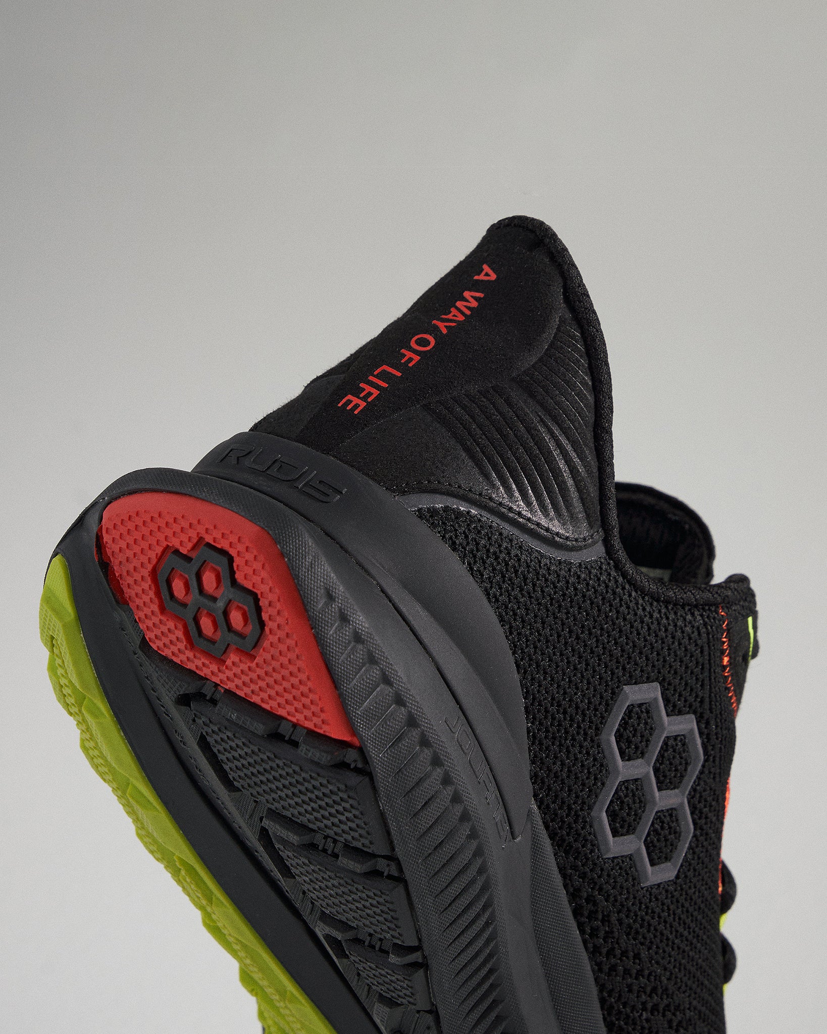 A close-up view of a black athletic shoe showcasing its modern design featuring a breathable upper colorful accents and a durable sole for performance