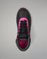 A black athletic wrestling shoe shown from a top-down view, featuring vibrant hot pink accents on the collar, around the laces, and on the inner lining, with a black geometric logo on the tongue.