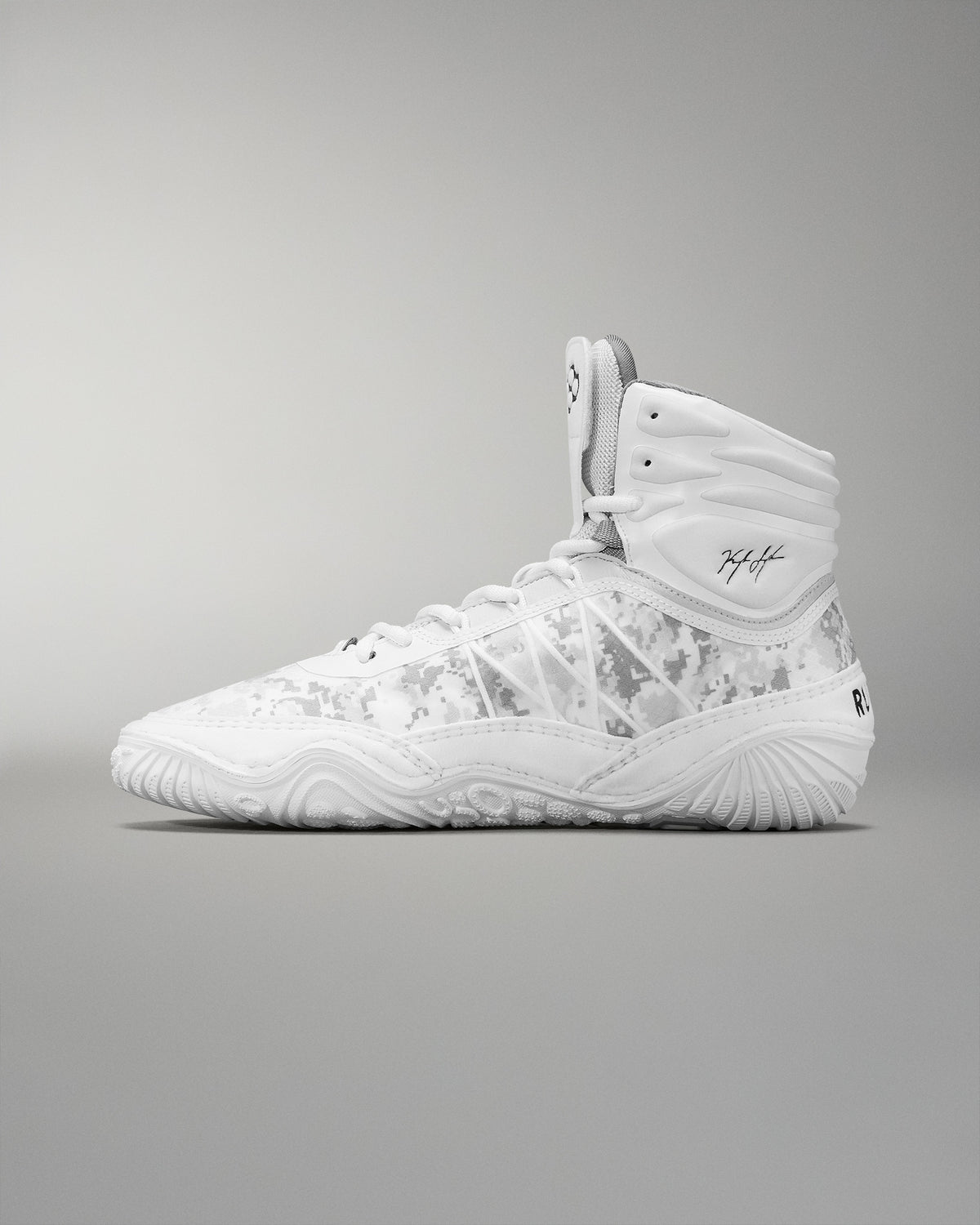 A high-top wrestling shoe  in white with a subtle camouflage pattern includes a padded collar and textured sole for grip, suitable for sports activities.
