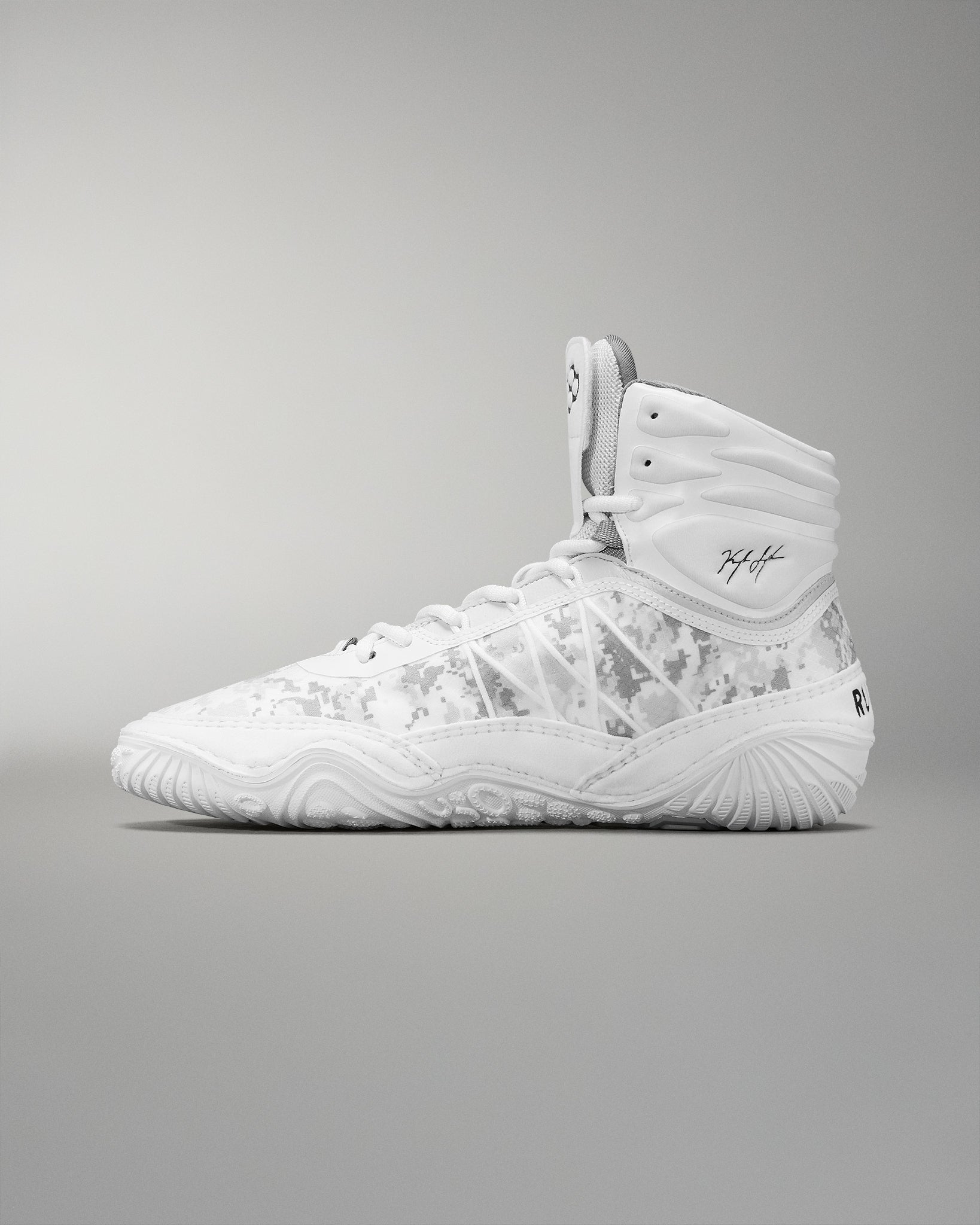 A high-top wrestling shoe  in white with a subtle camouflage pattern includes a padded collar and textured sole for grip, suitable for sports activities.
