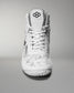 High-top wrestling shoe showcases a white camo design and textured sole, featuring a padded collar and reinforced toe for sports performance.