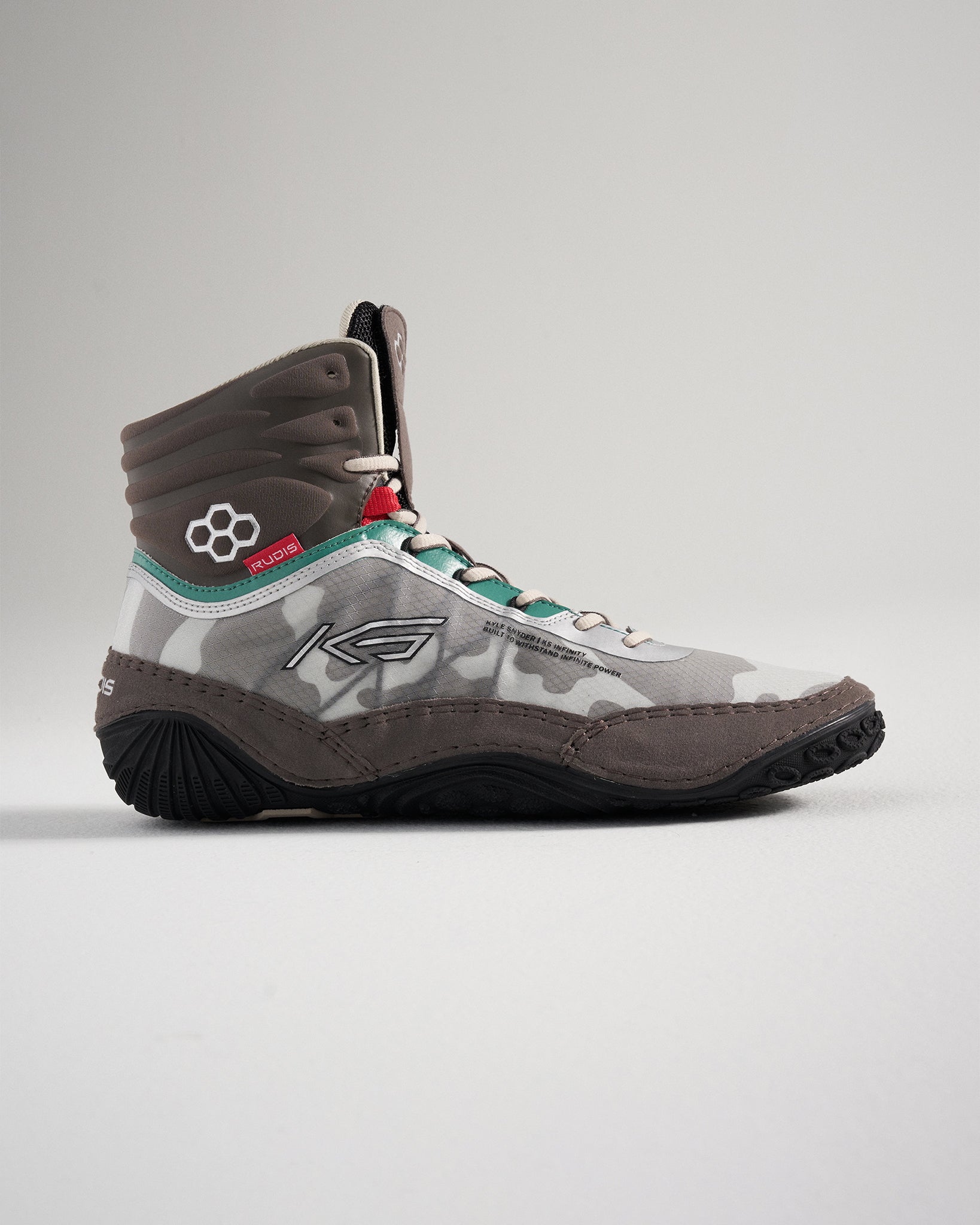 A modern grey and camouflage high-top athletic shoe with unique design features and textured sole