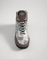 A stylish gray and white camouflage boot with colorful accents and sturdy construction highlighting a blend of modern design and functional features