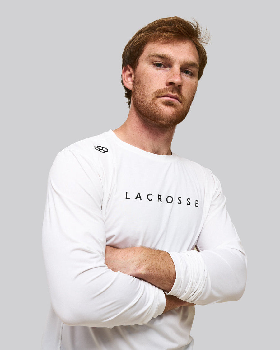 Chris Kavanagh wearing RUDIS lacrosse apparel, showcasing a long sleeve performance training shirt for lacrosse athletes and everyday performance.