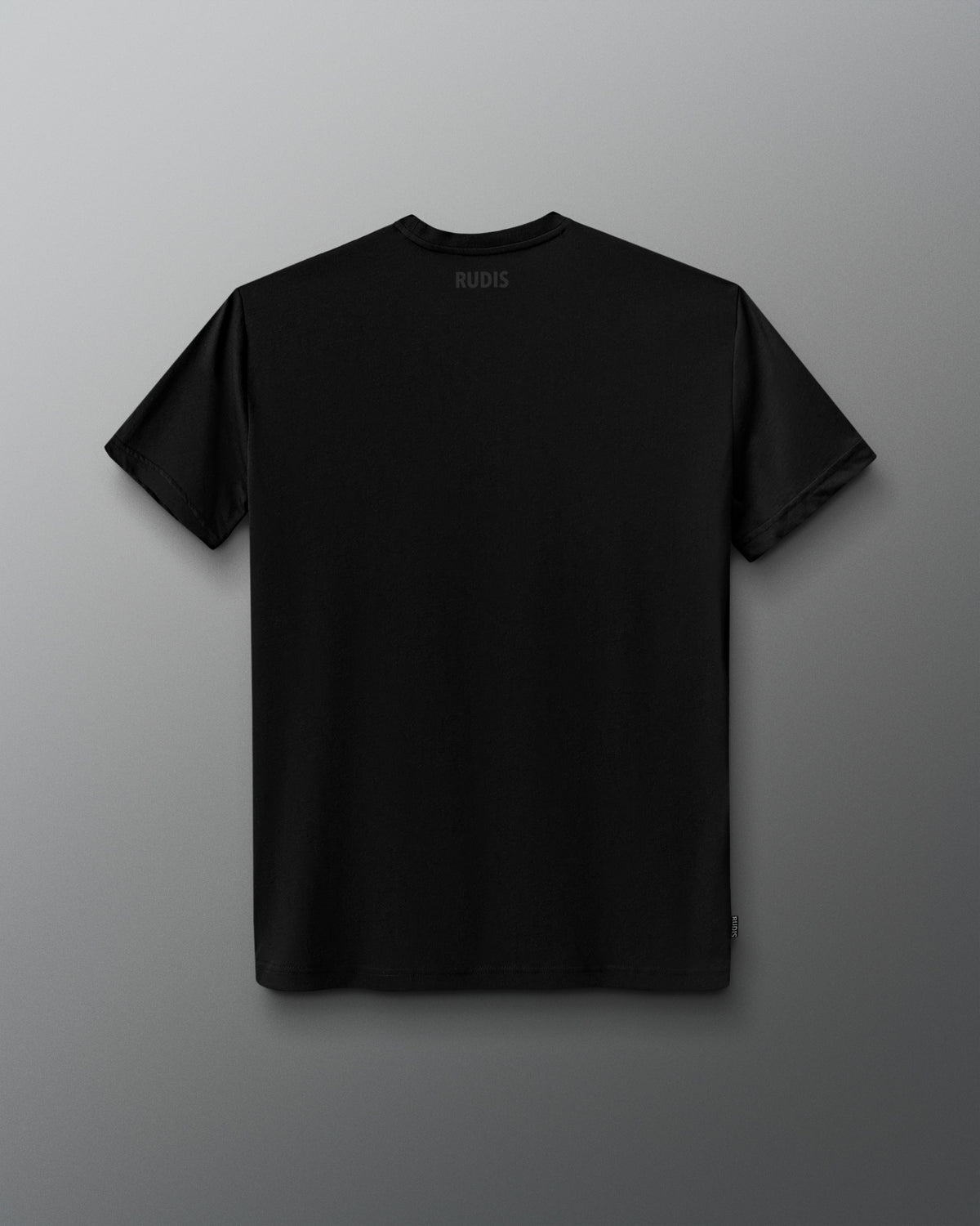 A black short-sleeve crewneck t-shirt shown from the back, featuring a small white 'RUDIS' logo printed inside the collar, displayed against a dark gray gradient background.