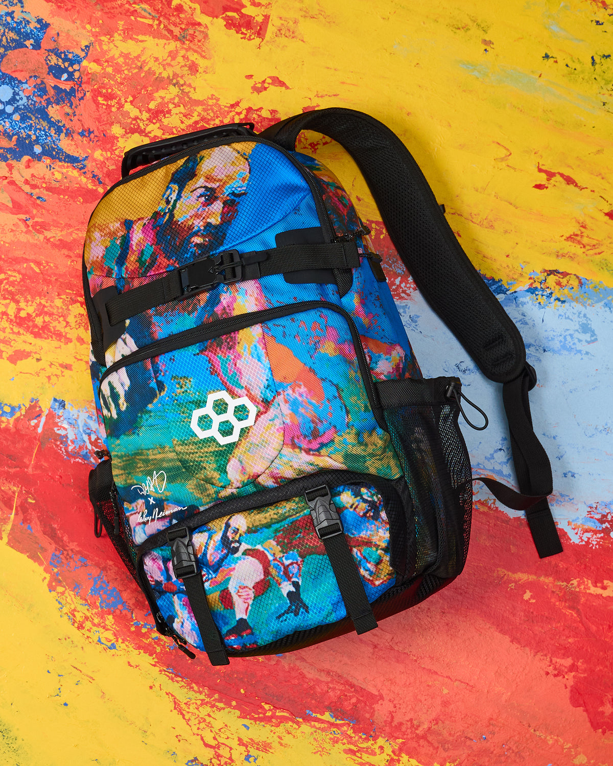 Colorful backpack with a brand logo on a multicolored abstract background
