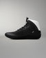 Black wrestling shoe with white heel on a gray background
