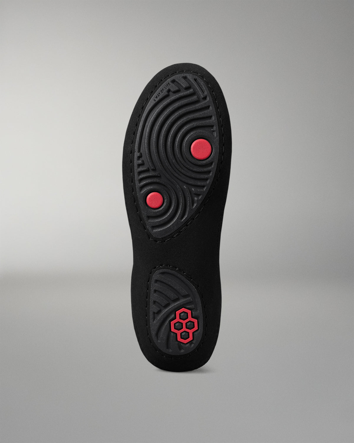 Black insole with red accents on a gray background