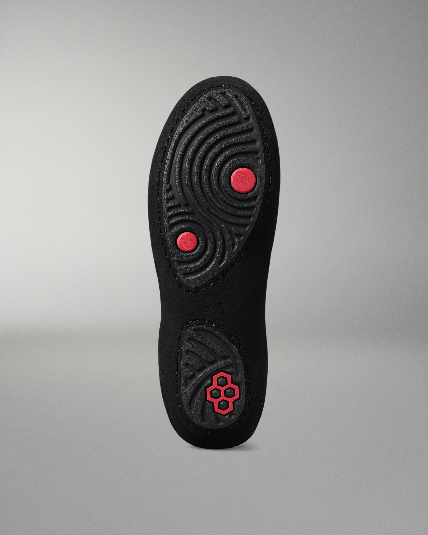 Black insole with red accents on a gray background