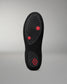 Black insole with red accents on a gray background