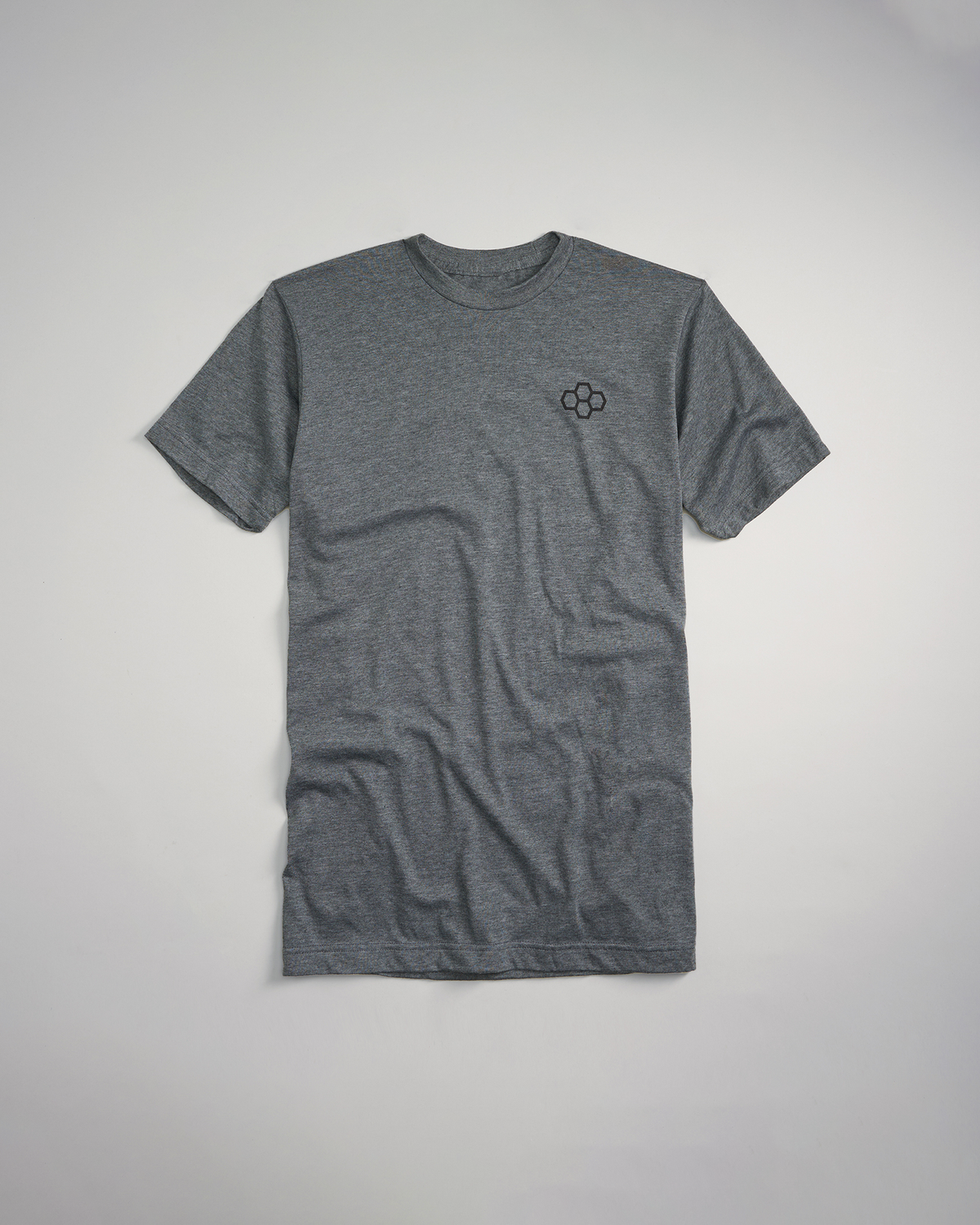 A gray t-shirt with a subtle embroidered logo on the chest featuring a classic crew neck design