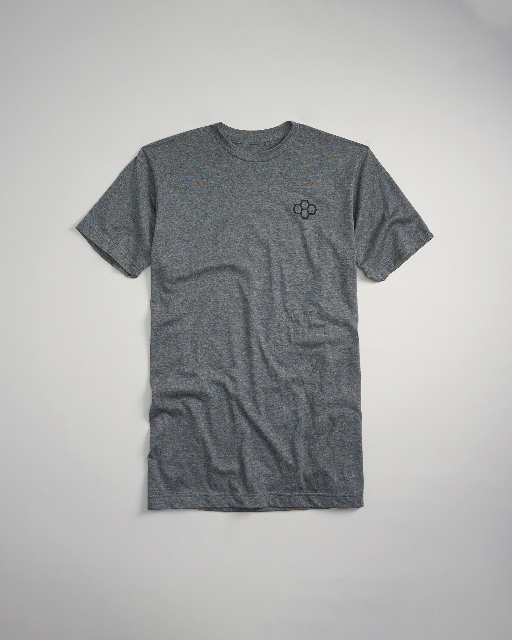 A gray t-shirt with a subtle embroidered logo on the chest featuring a classic crew neck design