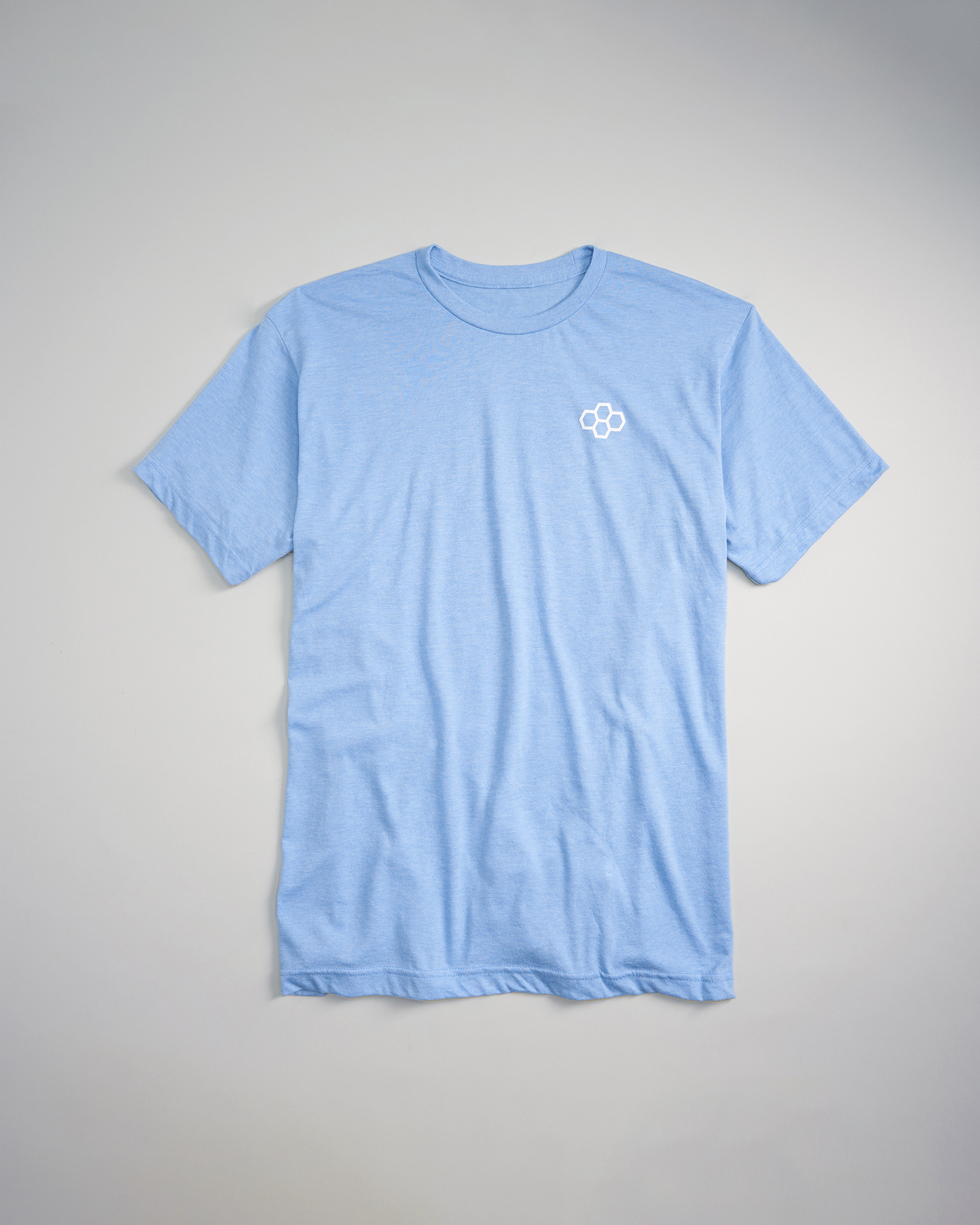 A light blue crew-neck t-shirt made from soft fabric featuring a small white logo on the chest area