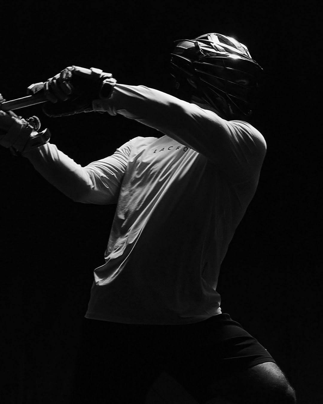 Lacrosse player in motion wearing RUDIS performance apparel, highlighting speed, agility, and athletic training for competitive play.