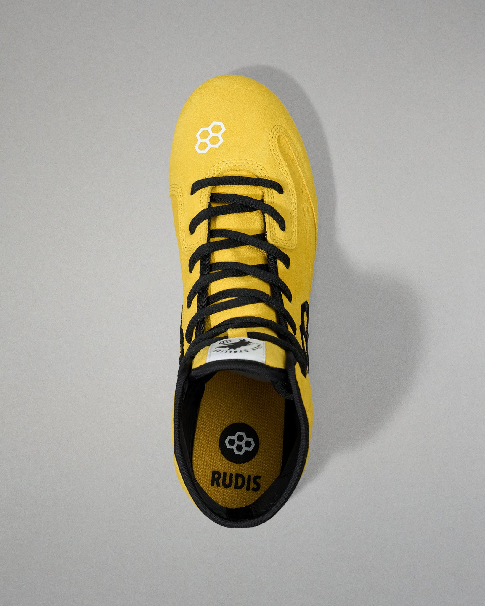 Top view of the yellow and black RUDIS Rocky International Adult Wrestling Shoe showing the lace system and RUDIS footbed.