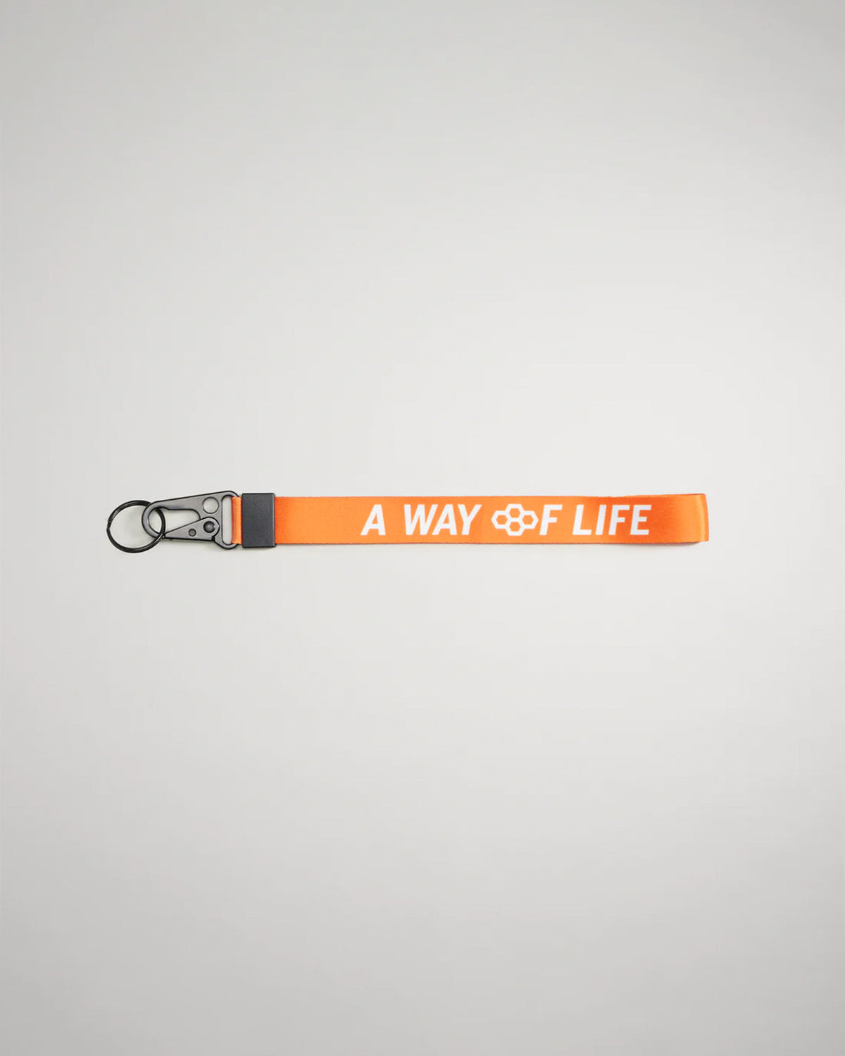 An orange lanyard featuring the phrase A WAY OF LIFE in white lettering with a metal clip and keyring attachment for versatility