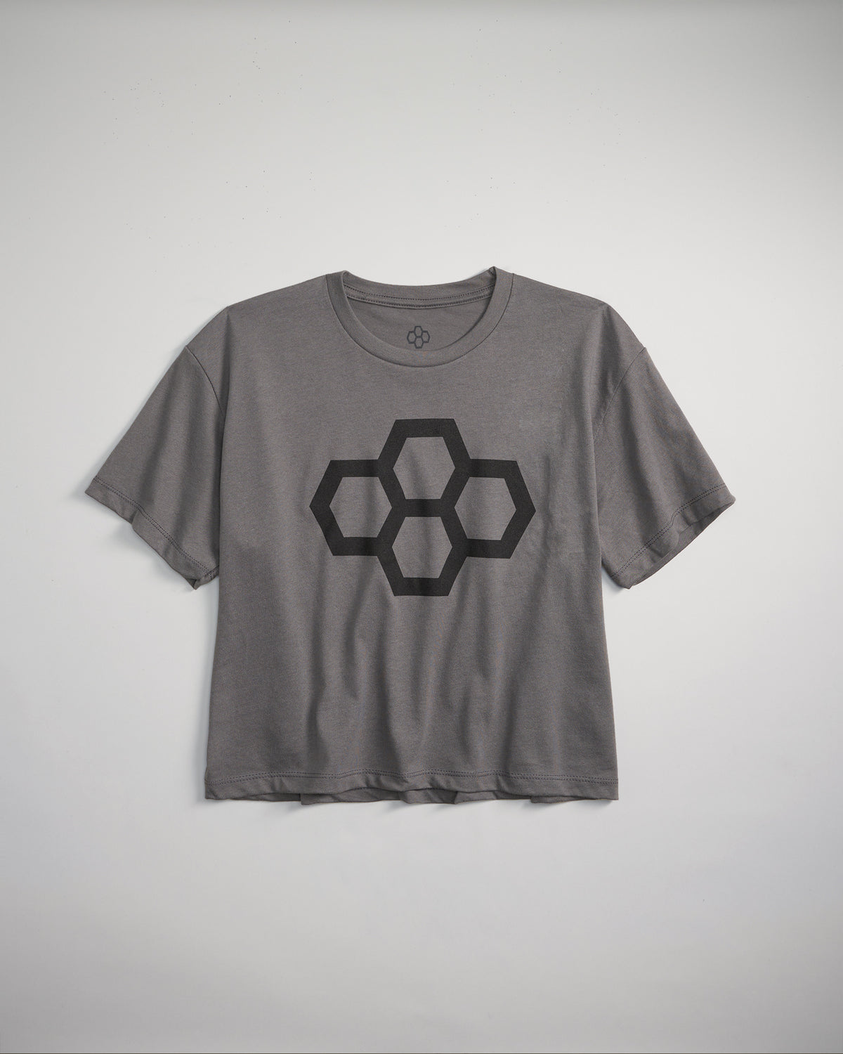 A casual gray t-shirt featuring a geometric hexagon design in black displayed on a neutral background