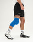 Person wearing blue knee pads on a white background
