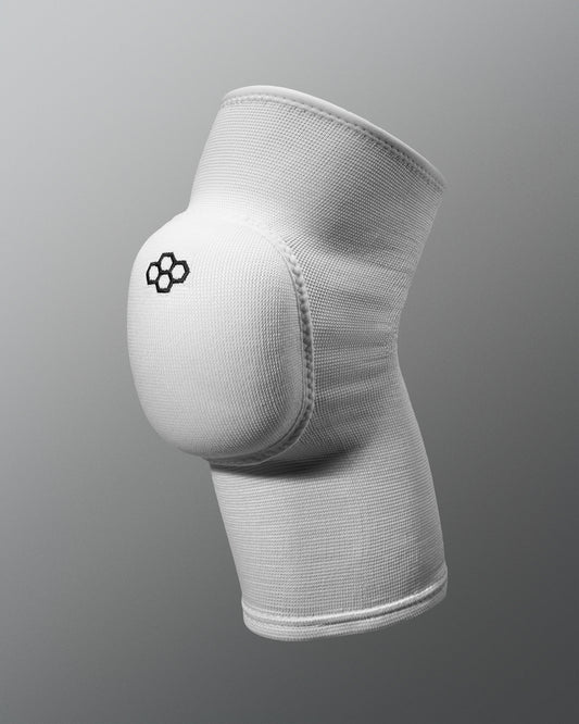 White knee pad with a logo on a gray background