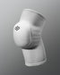 White knee pad with a logo on a gray background
