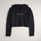 A cropped black hoodie featuring the phrase A WAY OF LIFE in a simple font designed for a casual and stylish look