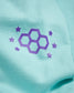 A close-up view of a teal fabric featuring a purple graphic design consisting of hexagons and stars
