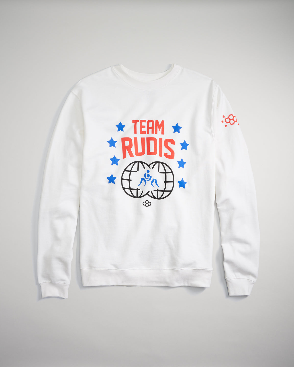 A white sweatshirt featuring the text TEAM RUDIS a globe design and blue stars symbolizing unity and support for an athletic team