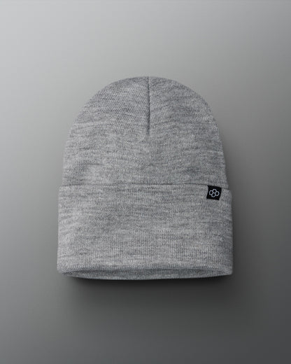 Gray beanie with a small logo on a gray background