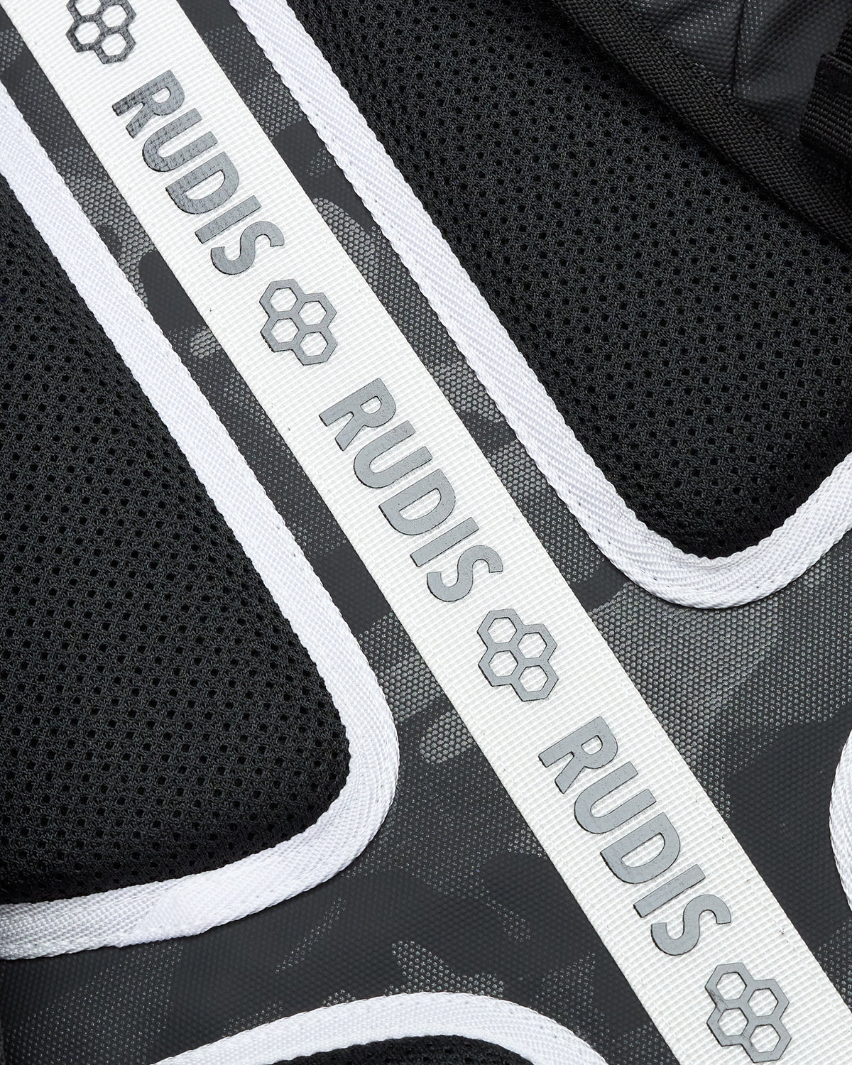 Close-up of a black and gray product with 'RUDIS' branding.