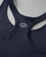 A close-up of a dark blue sports bra with multiple straps and a light-colored logo, emphasizing both style and functionality, set against a subtle gray background.