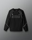 Black long-sleeve athletic shirt with 'RUDIS' branding on a gray background