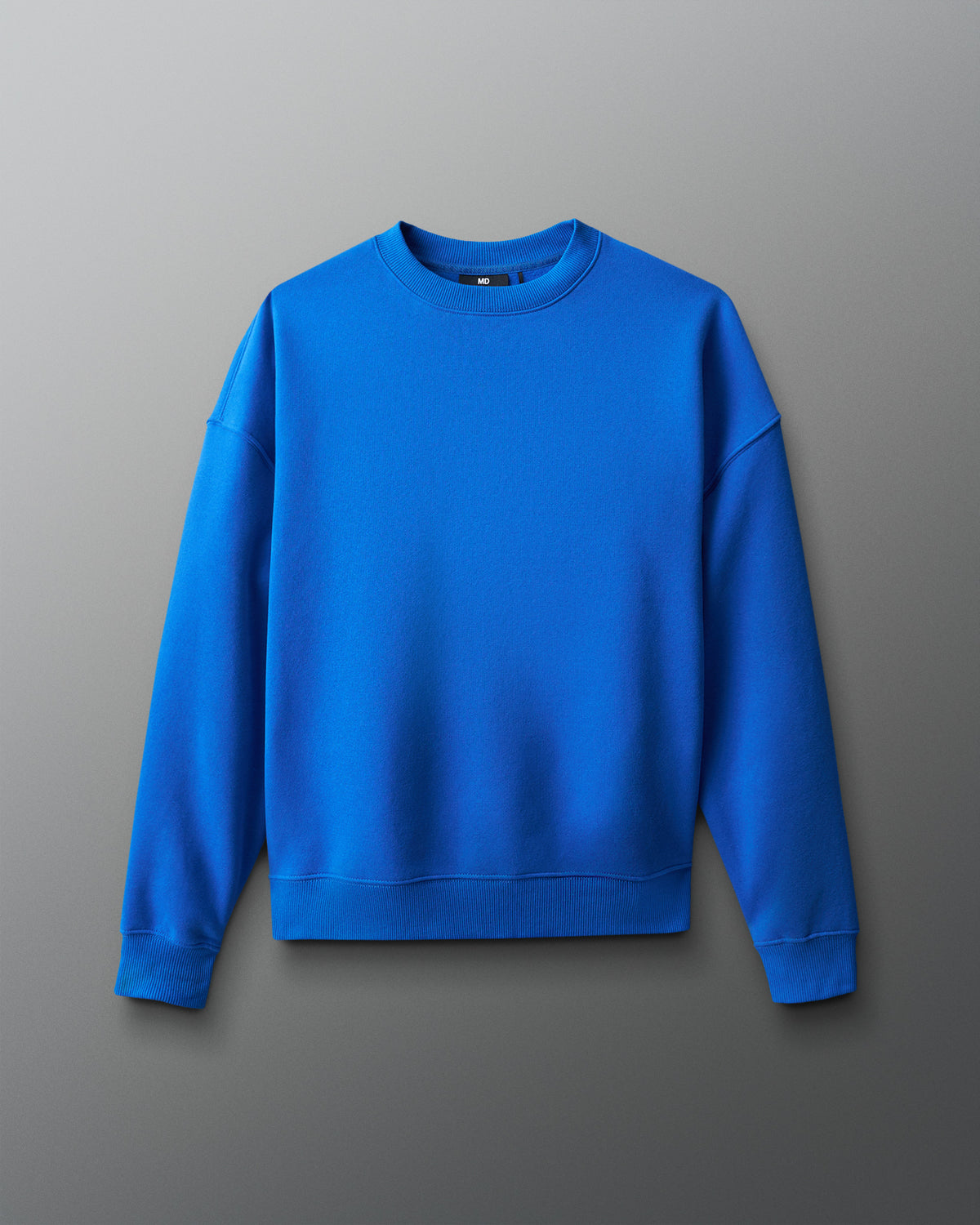 Blue sweatshirt on a gray background