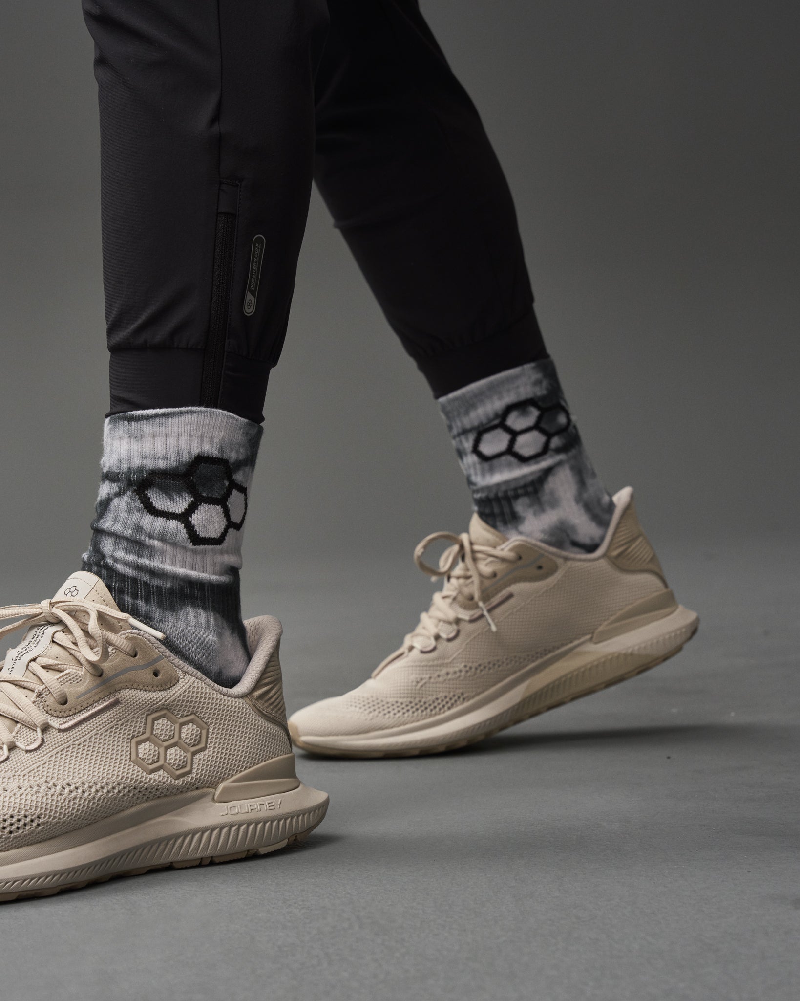 A stylish athletic footwear paired with unique patterned socks showcasing a modern sportswear look
