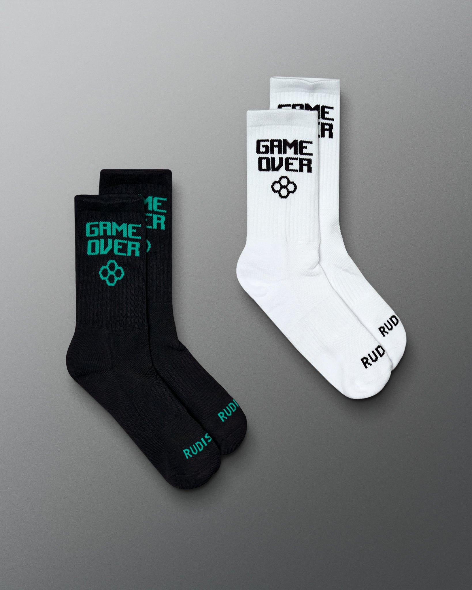 Arcade Cushion Crew Socks two-pair set in black and white, featuring “GAME OVER” graphics and RUDIS branding.