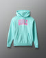 Light blue hoodie with pink text on a gray background