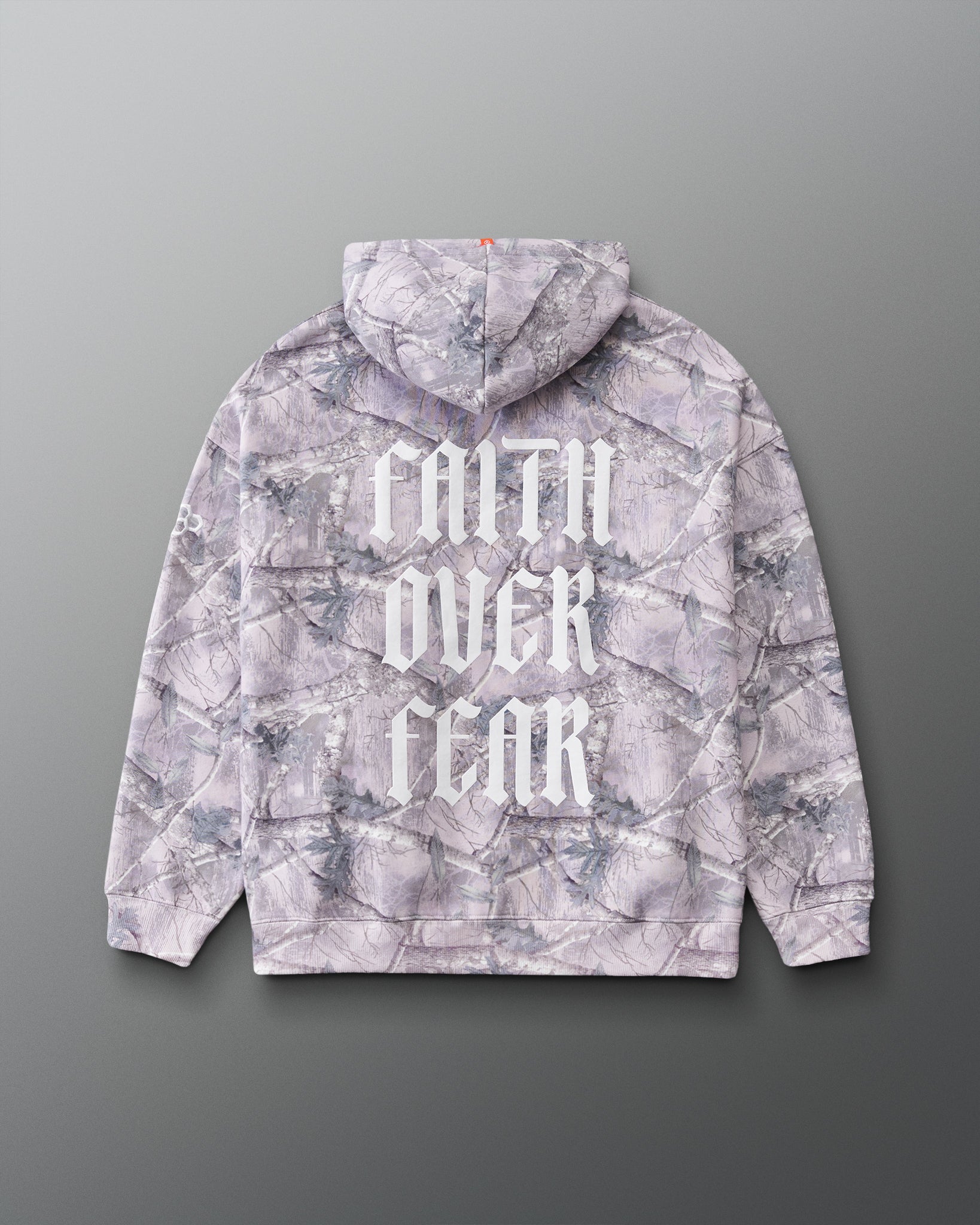 Back view of the RUDIS Faith Over Fear Relaxed Comfort Fleece Hoodie in Tree Camo, featuring bold white Faith Over Fear lettering across the back and an allover woodland camouflage print.
