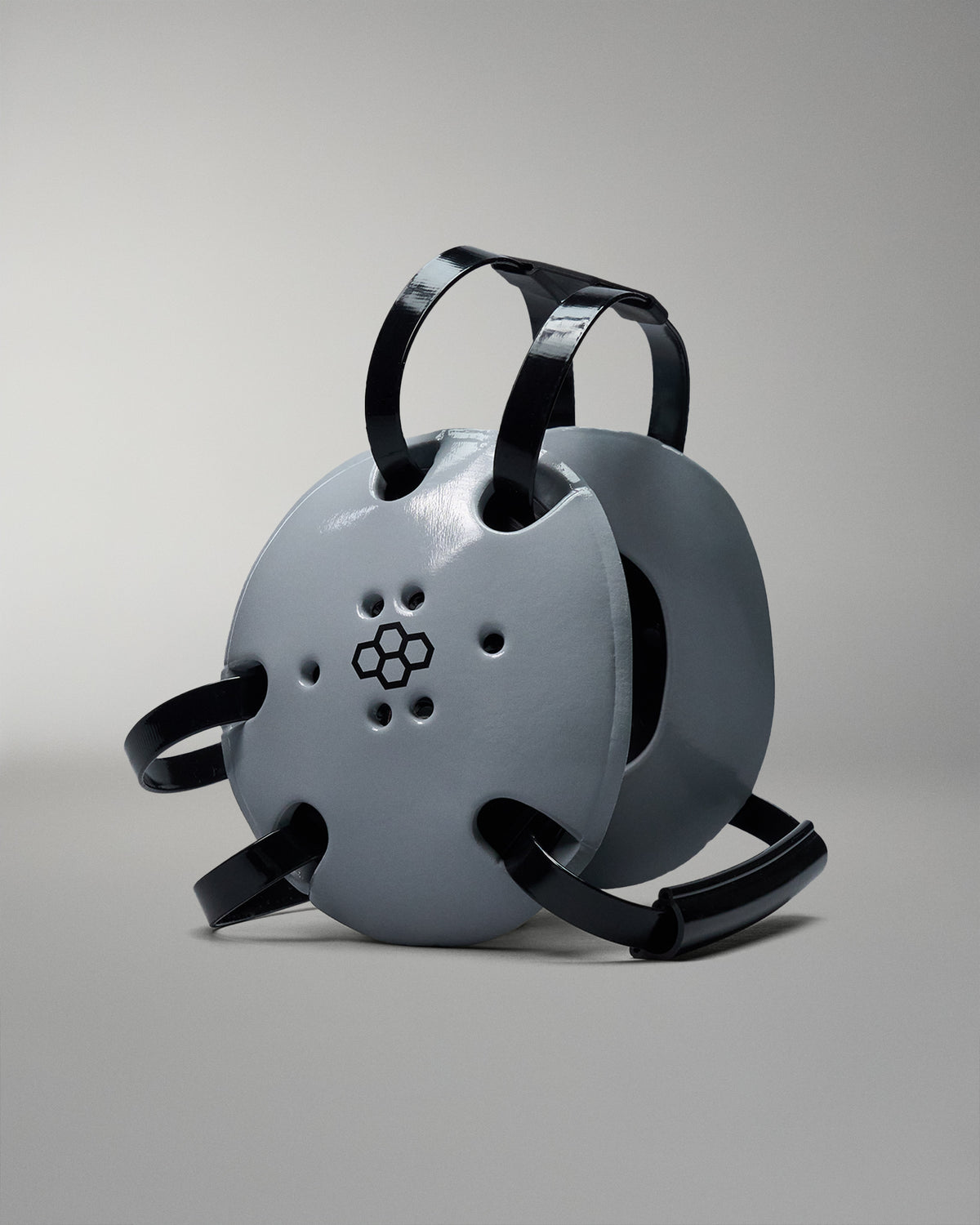 Grey wrestling headgear with black RUDIS logo. Black straps.
