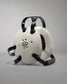 WHITE WRESTLING HEADGEAR - A futuristic helmet with a white shell, black accents, and ventilation holes, presented against a gray background.