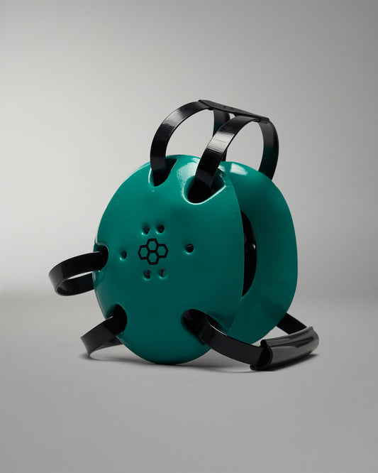 Teal device with black straps on a gray background