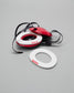 Red and white wrestling headgear extension pads with 'RUDIS' branding on a gray background