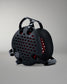 Black wrestling headgear with red interior on a gray background