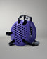 Purple wrestling headgear with black straps on a gray background